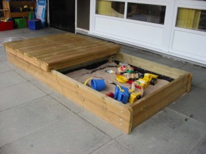 Sandbox with sliding lid